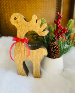 Wood reindeer with red ribbon and bells