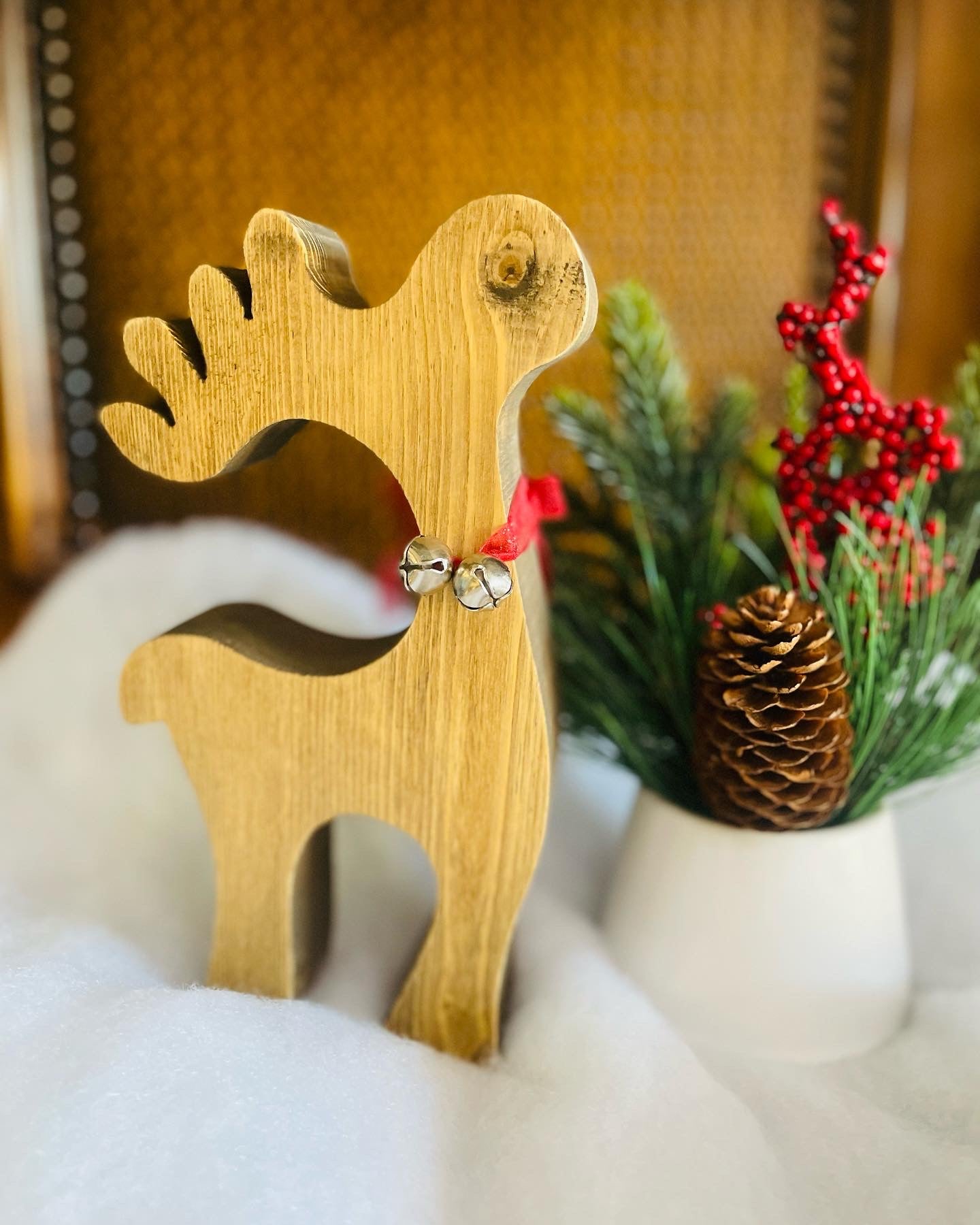 Wood reindeer with red ribbon and bells